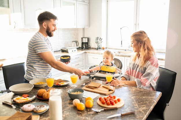 Happy Family Enjoying Breakfast in Morning