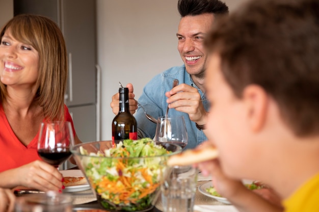 Happy family enjoying lunch together at home