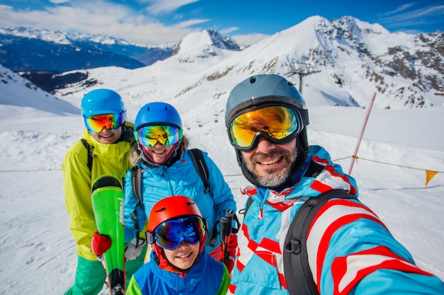 Happy family enjoying winter vacations in mountains