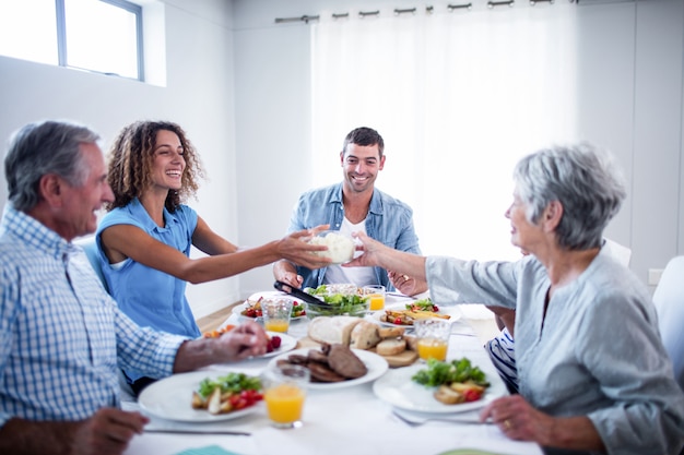 Happy family having breakfast together