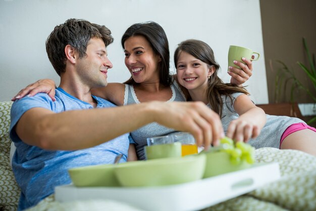 Happy family having breakfast