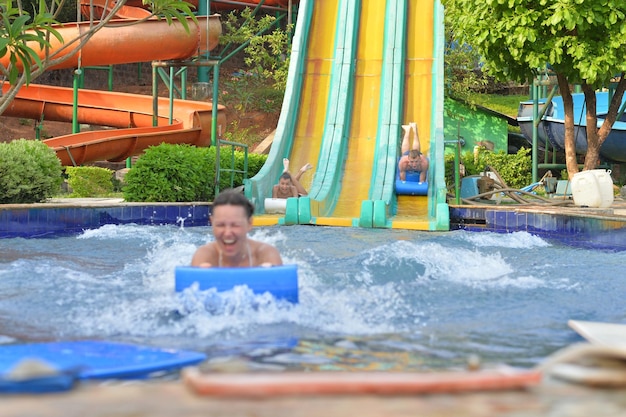 Happy family having fun in aqua park