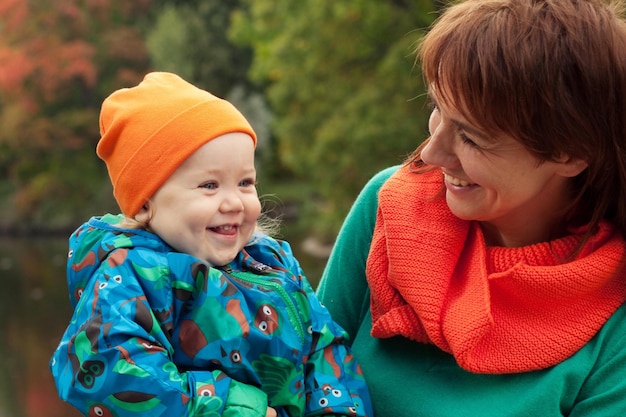 Happy family having fun in autumn park