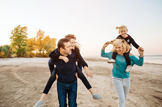 Happy family having fun by the river