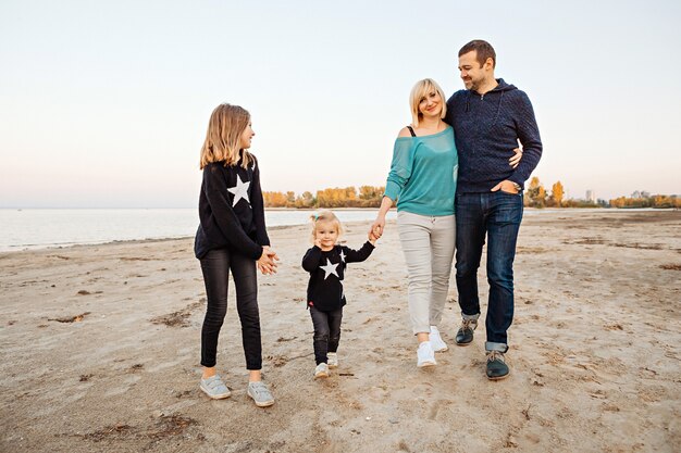 Happy family having fun by the river