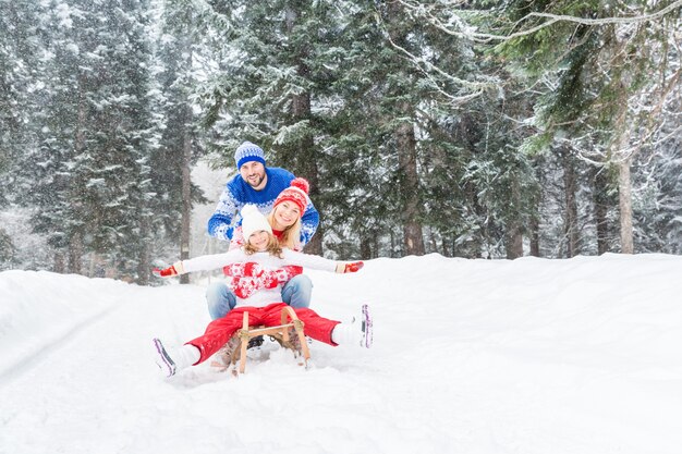 happy family having fun outdoor child mother and father playing in winter time healthy lifestyle