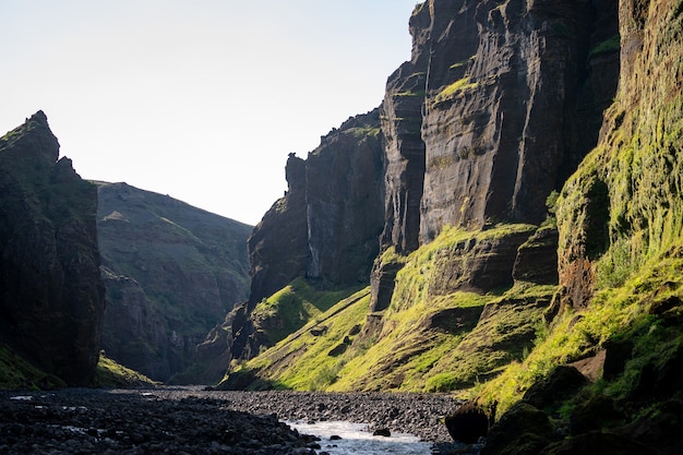 happy family hiking together in the Stakkholtsgja Canyon, Iceland. Walking along a scenic trail.