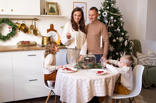 Happy family in the kitchen Parents and children in kitchen at home