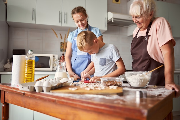 Happy family learning how to cook at home