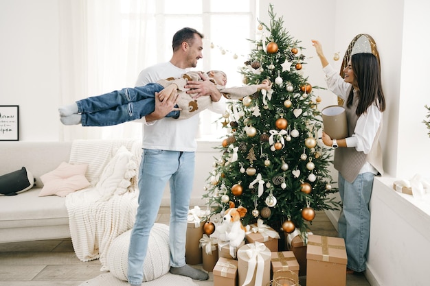 Happy family making christmas decorations at home together