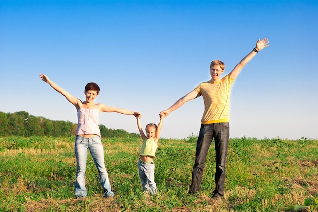 Happy family in a meadow