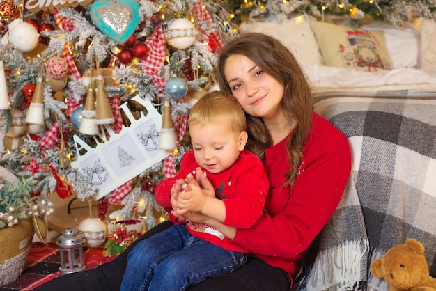 happy family mom and baby together in christmas