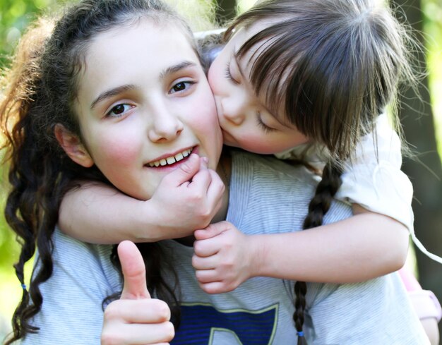 Photo happy family moments - sisters have a fun.