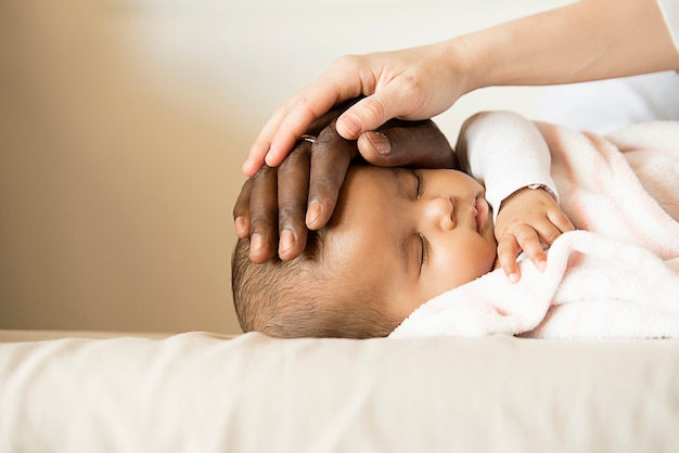 Happy Family, Mother and Father Care Sleeping Baby