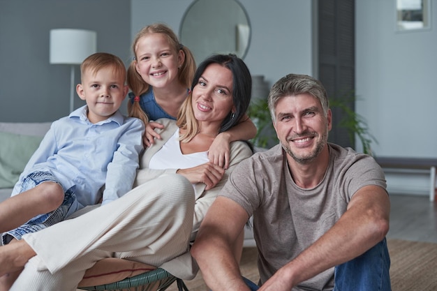 Happy family mother father and children at home