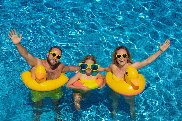 Happy family in outdoor pool