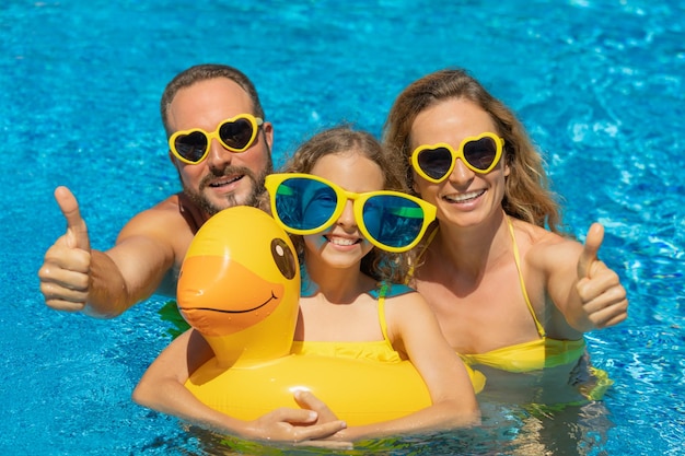 Happy family in outdoor pool