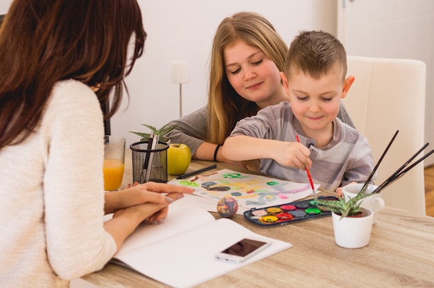 Happy family painting at home