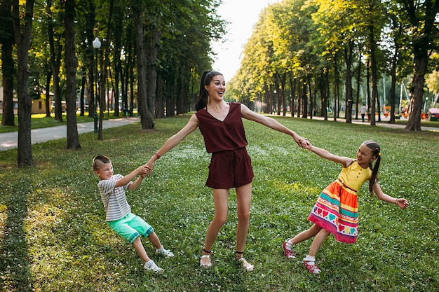 happy family picnic. mother and two kids in nature park