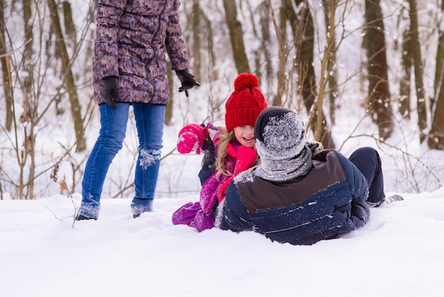 Happy family playing with snow