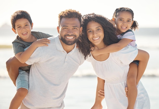 Happy family portrait smile and beach vacation or holiday summer trip Mother father and children little boy and girl relax time together on ocean sea shore bonding and love care and coast fun