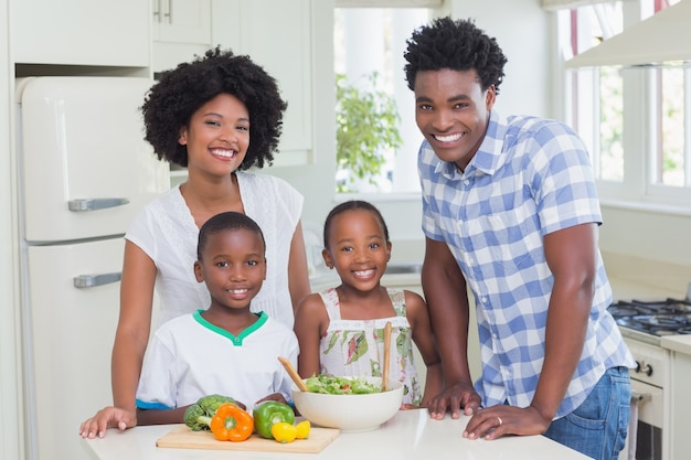 Happy family preparing vegetables together