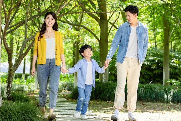 Happy family relaxing in the park at black friday