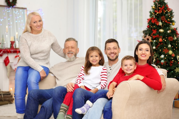 Happy family resting in room decorated for Christmas