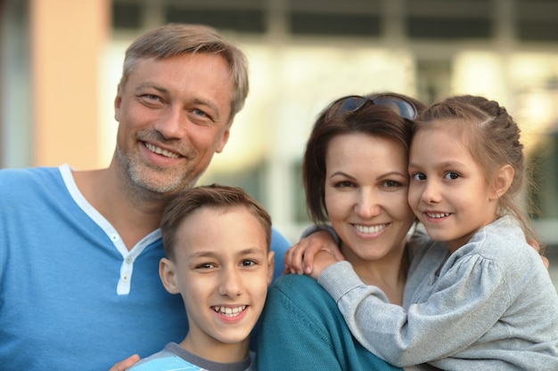 Happy Family resting in a summer park