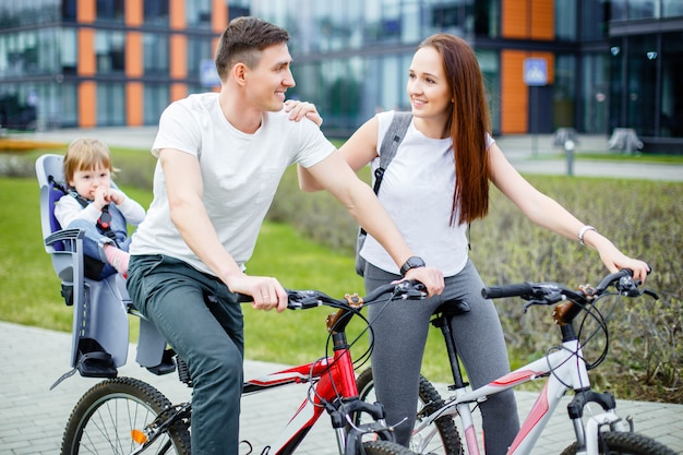 Happy family riding bicycles