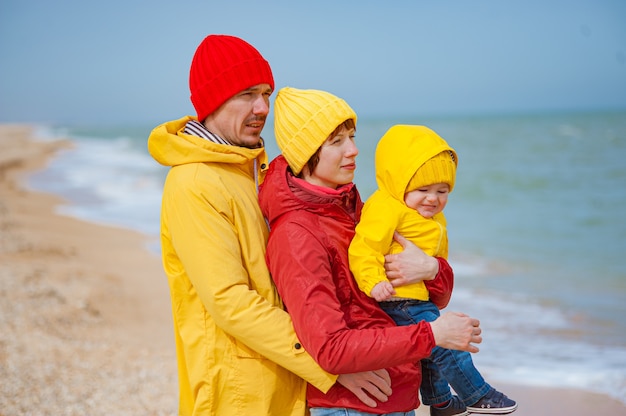 Happy family at the seashore in winter