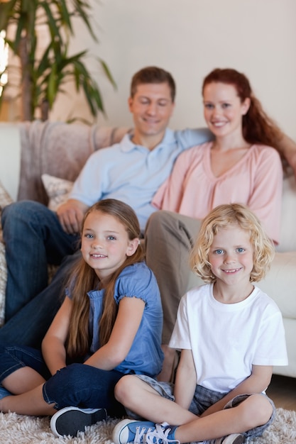 Happy family sitting in the living room