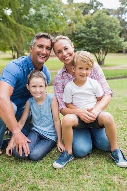 Happy family smiling at the camera 