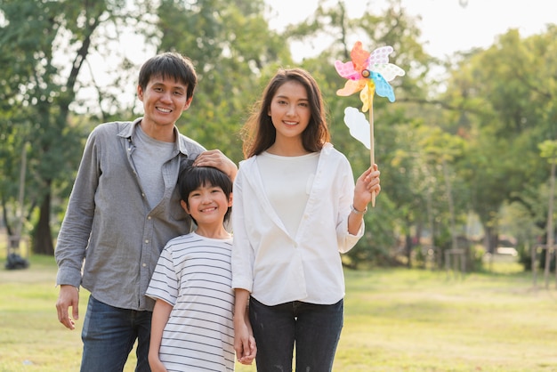 Happy family smiling together in the park