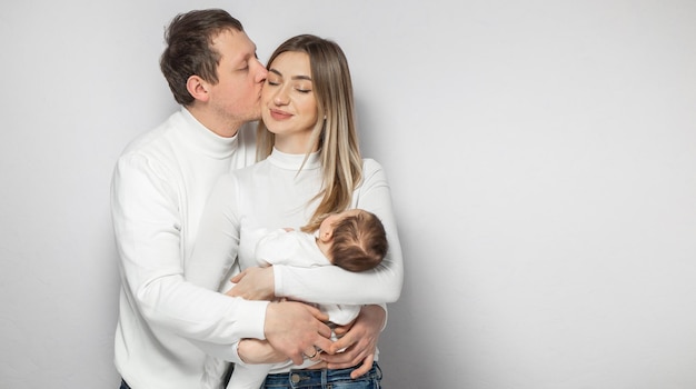 Happy family in the studio on a white background