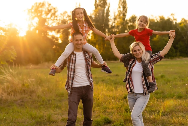 Happy family on sunset in nature