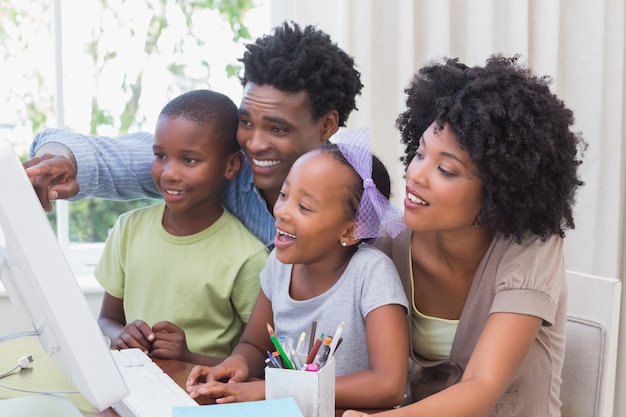 Happy family using the computer