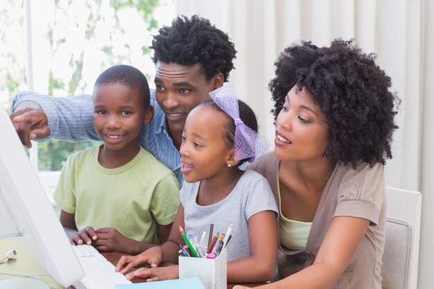 Happy family using the computer