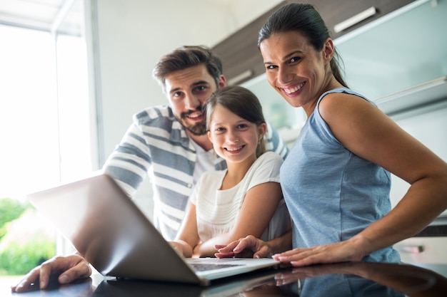  happy family using laptop in the living room