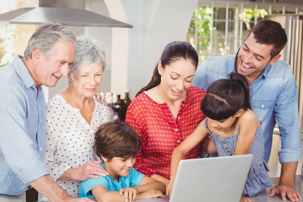 Happy family using laptop