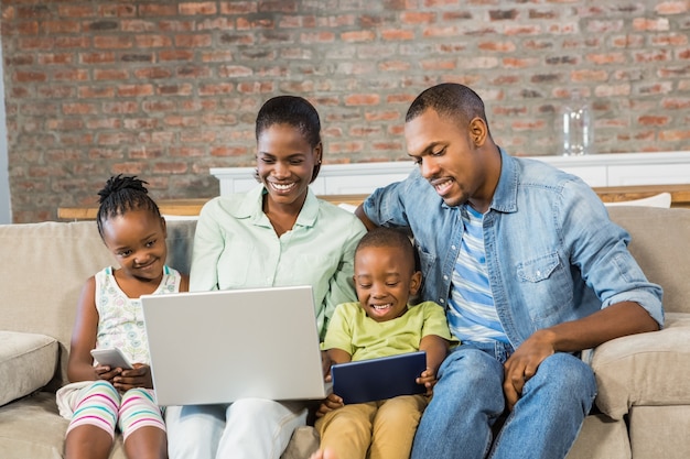 Happy family using technology together