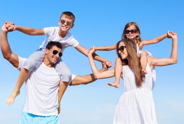 Happy family on vacations on beach