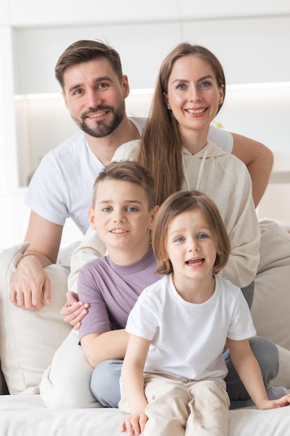 Happy family with children on sofa