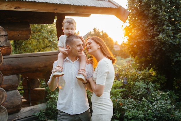 Happy family with their son walking in the Park at sunset. Happiness. Love