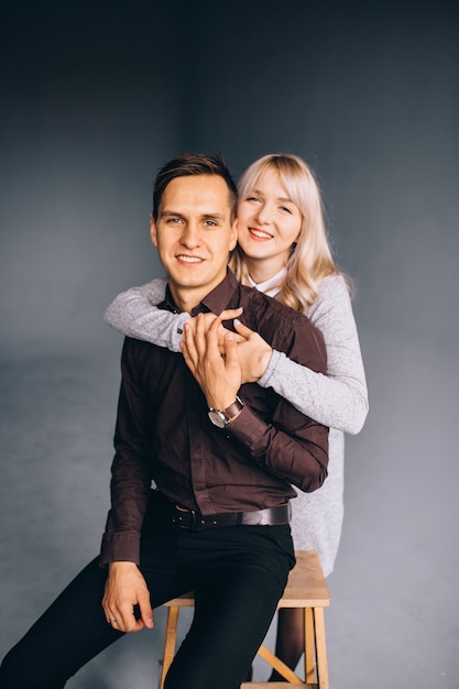 Happy fashion couple looking at the camera.