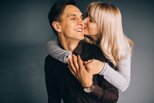 Happy fashion couple looking at the camera