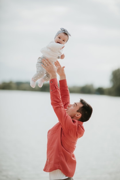 Happy father having fun with daughter