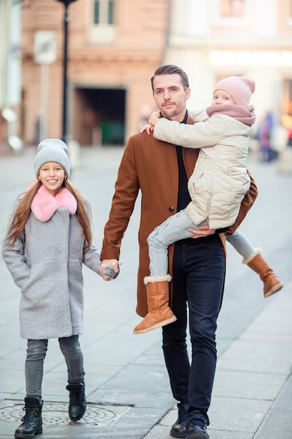 Happy father and little adorable girl in the city outdoors