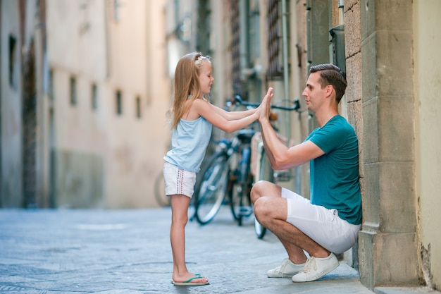 Happy father and little adorable girl in Rome during summer italian vacation