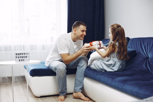 Happy father's day. Daughter greets dad. Little daughter with dad.